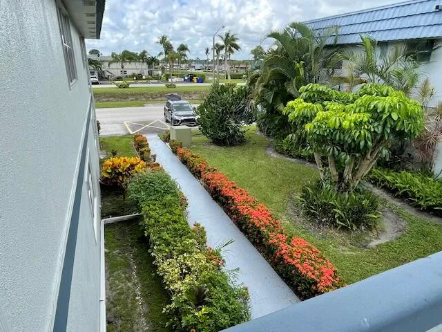 a view of a garden with sitting area