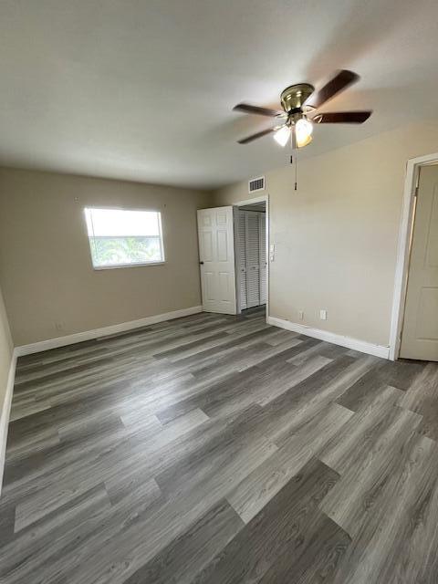 323 Tuscany Lane, Unit F Delray Beach, FL 33446 - Photo 7 of 12 a view of an empty room with a window