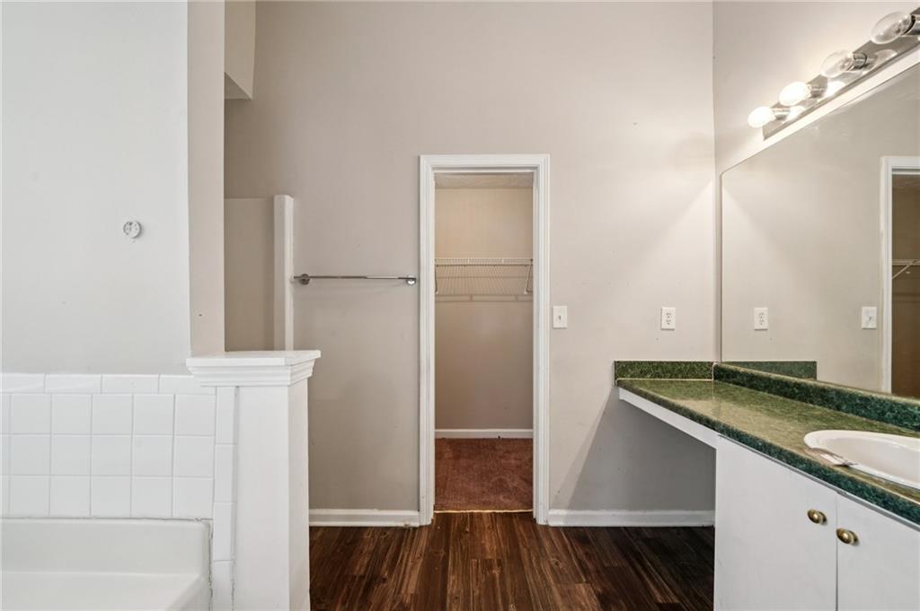 1443 Pebble Ridge Lane Hampton, GA 30228 - Photo 15 of 24 a bathroom with a granite countertop sink and a mirror