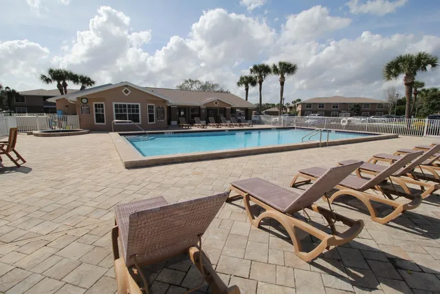 a view of a house with a garden and yard