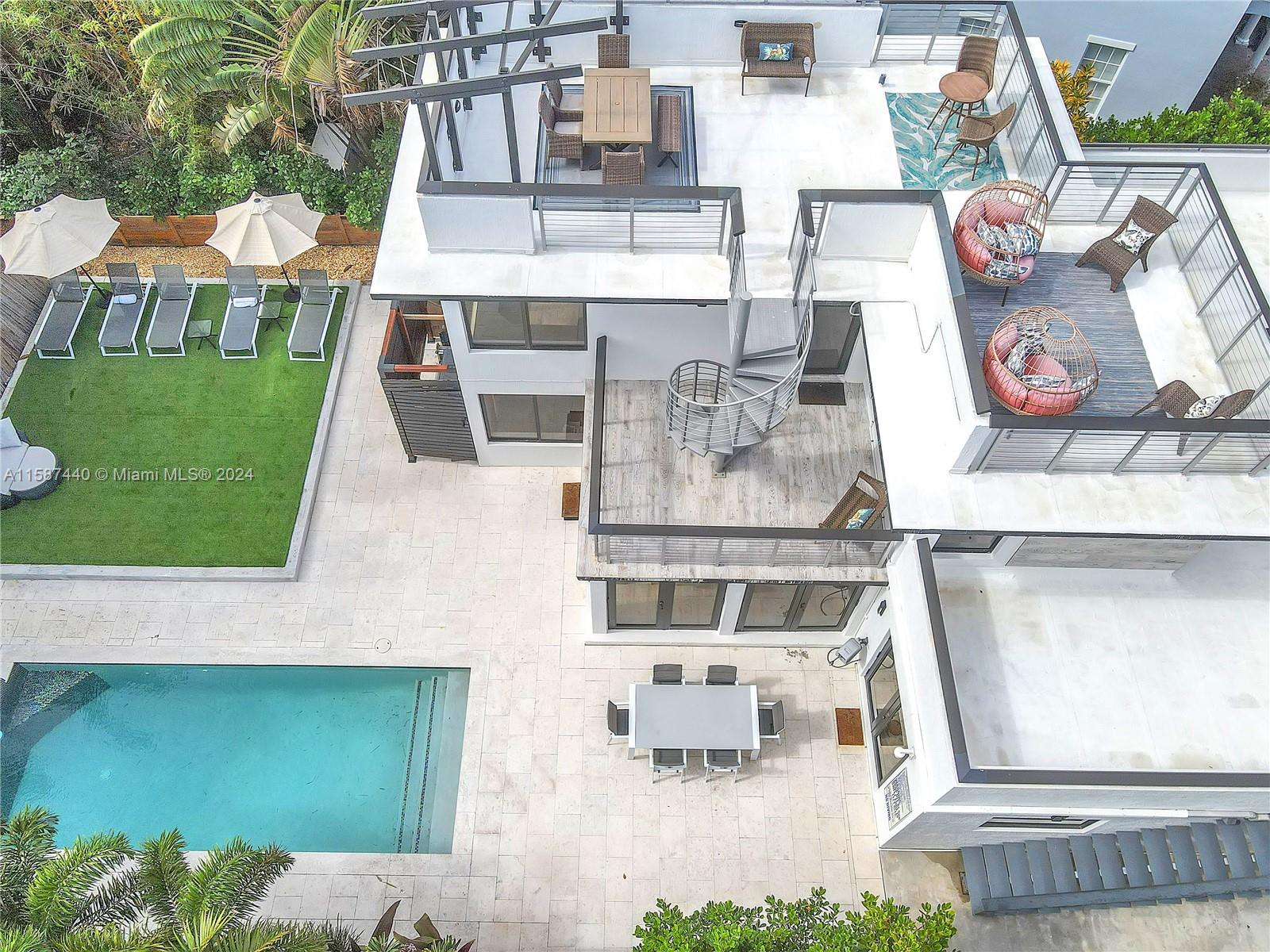 an aerial view of a house with outdoor space