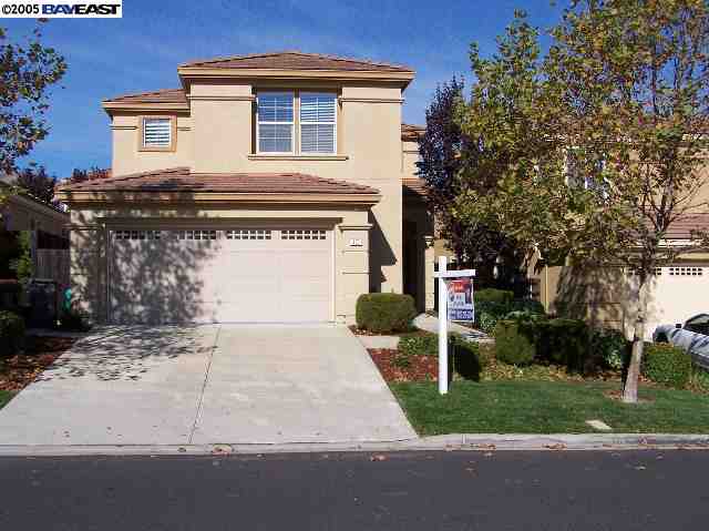 103 Pearlgrass Court San Ramon, CA 94582 - Photo 1 of 8 a front view of a house with a garden and trees