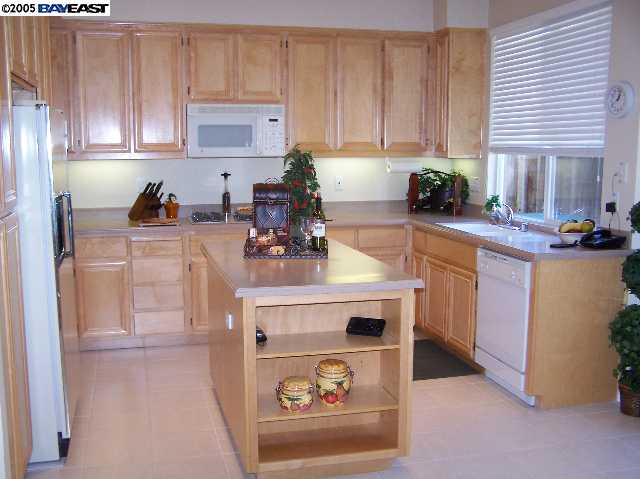 103 Pearlgrass Court San Ramon, CA 94582 - Photo 3 of 8 a kitchen with a sink cabinets and window