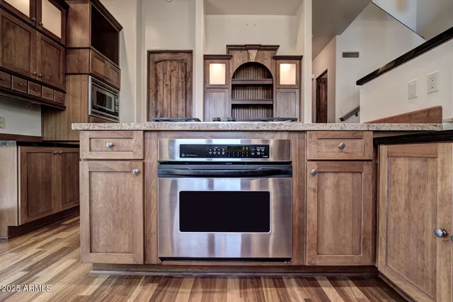a view of kitchen with furniture and a window