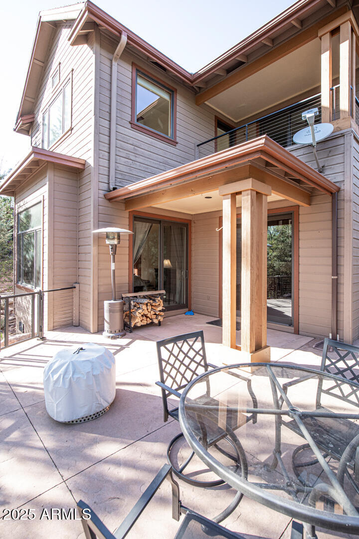 500 North Grapevine Drive Payson, AZ 85541 - Photo 18 of 55 a view of a patio with table and chairs and potted plants