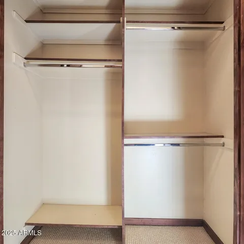 a view of room with window and ceiling fan