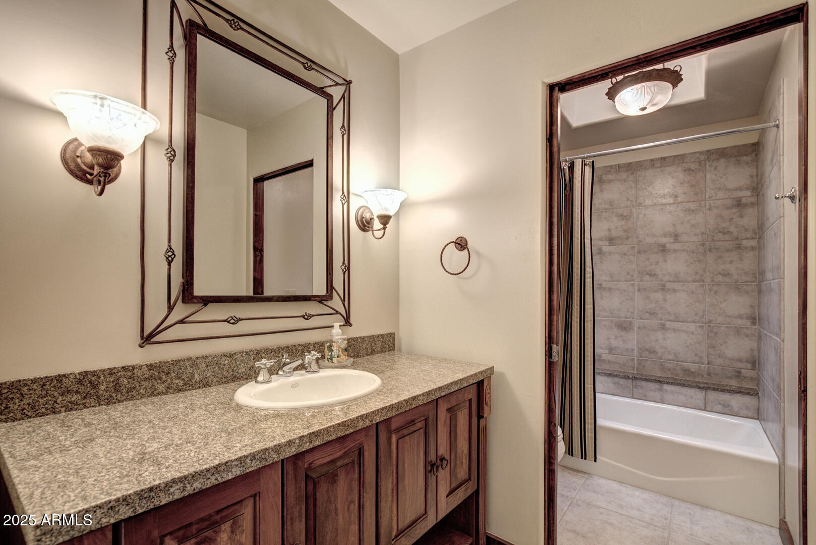 500 North Grapevine Drive Payson, AZ 85541 - Photo 34 of 55 a bathroom with a granite countertop sink a mirror and a shower