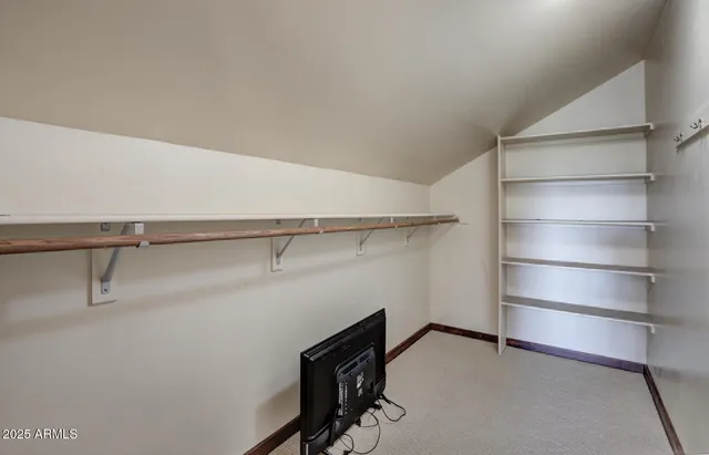 a view of a patio with table and chairs and potted plants