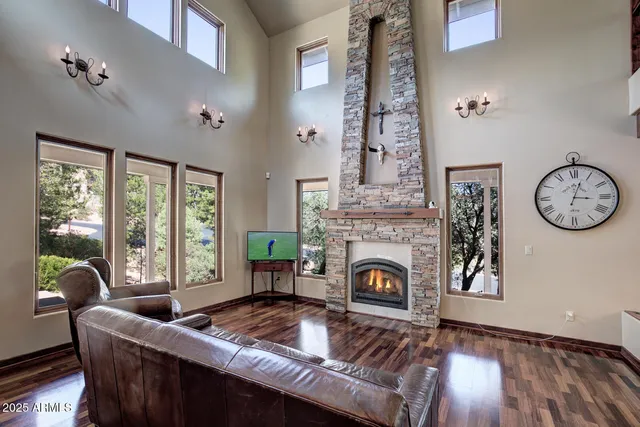 a living room with furniture and a large mirror