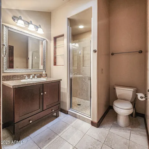 an aerial view of a house with a yard and outdoor seating
