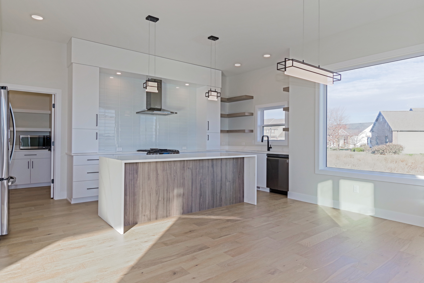 1252 Silver Oak Circle Normal, IL 61761 - Photo 12 of 46 a kitchen with kitchen island a counter top space a sink stainless steel appliances and cabinets