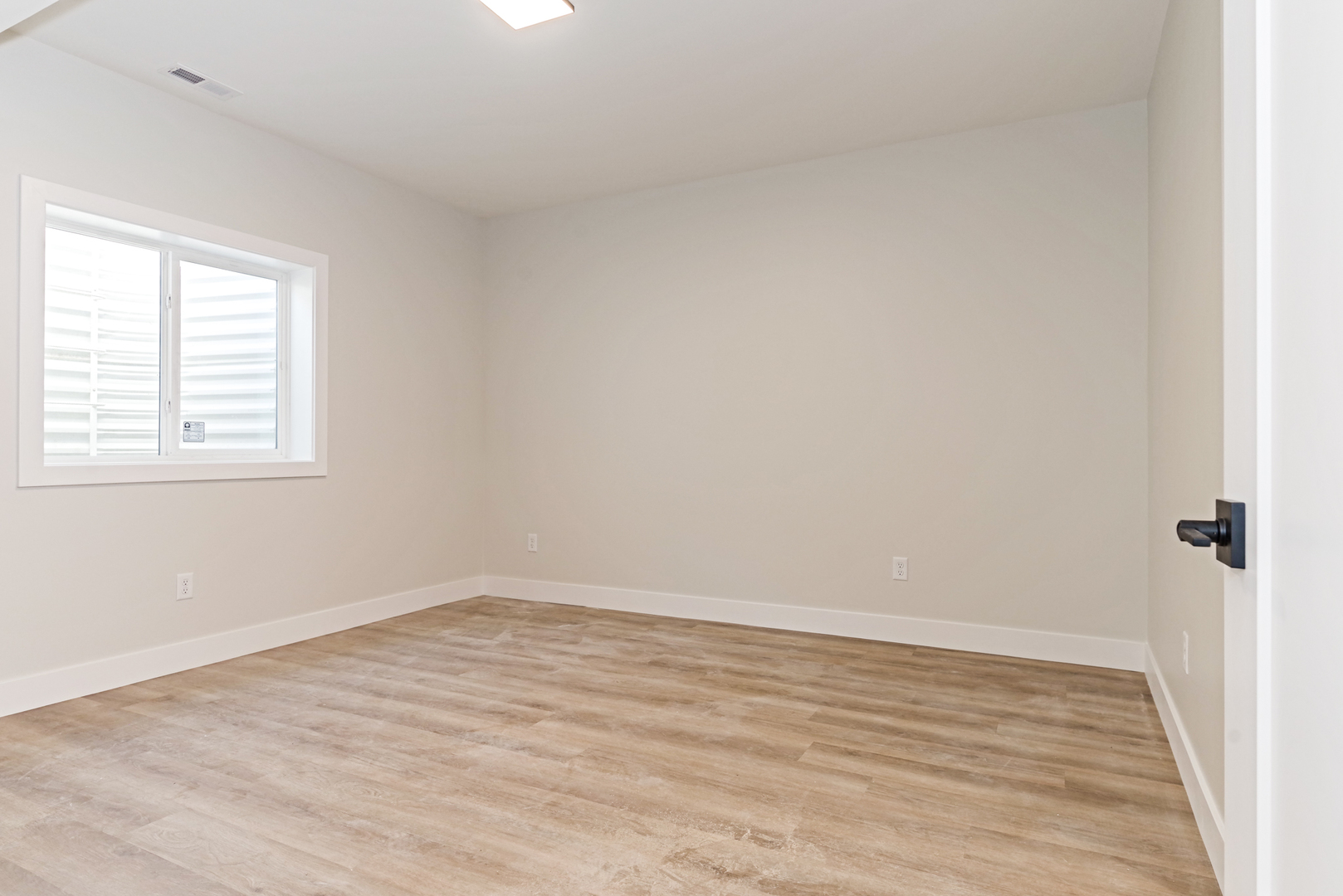 1252 Silver Oak Circle Normal, IL 61761 - Photo 42 of 46 wooden floor in an empty room with a window