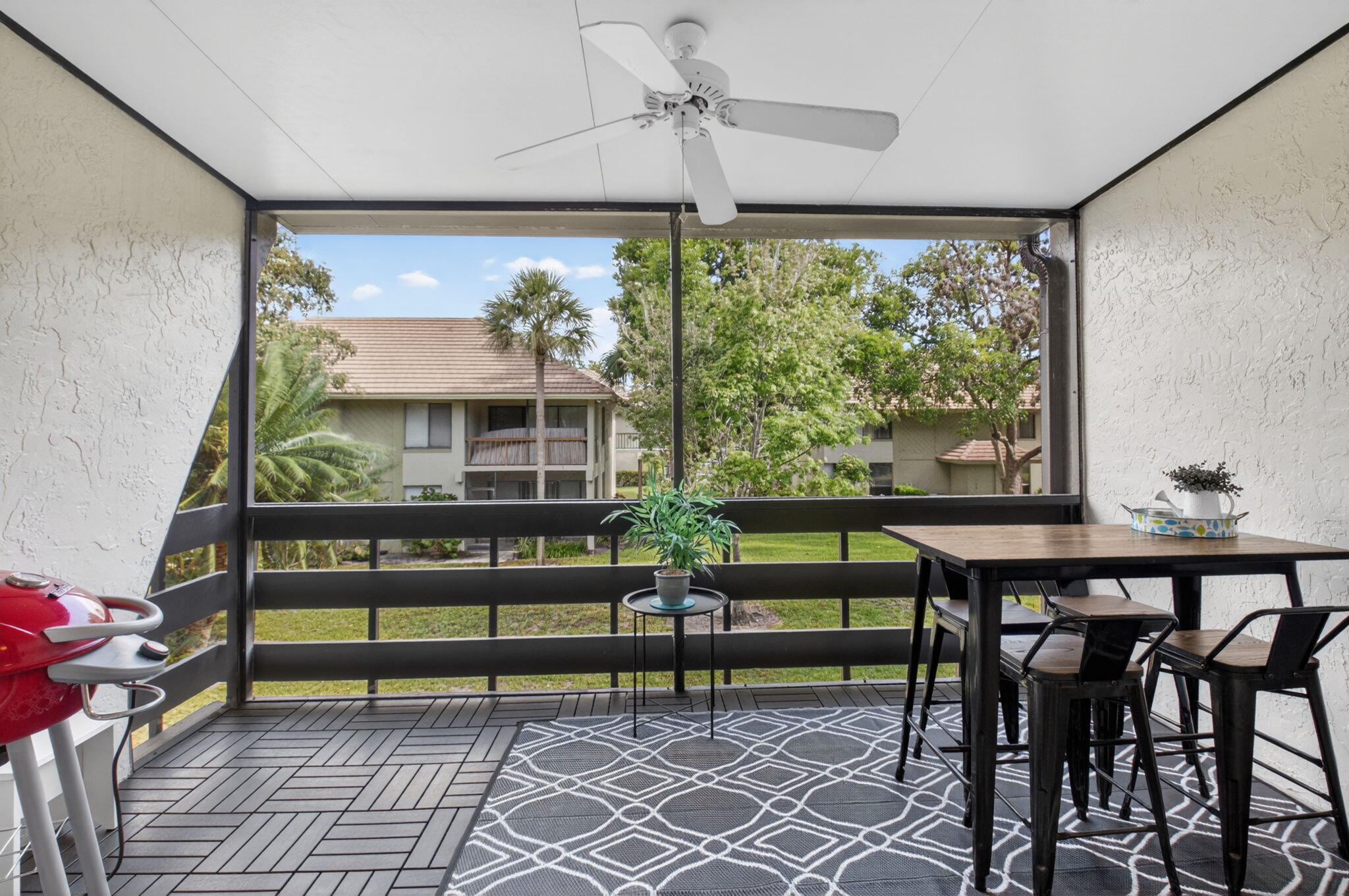 149 Northwest 70th Street, Unit 106C Boca Raton, FL 33487 - Photo 16 of 41 a view of a chairs and table in a room