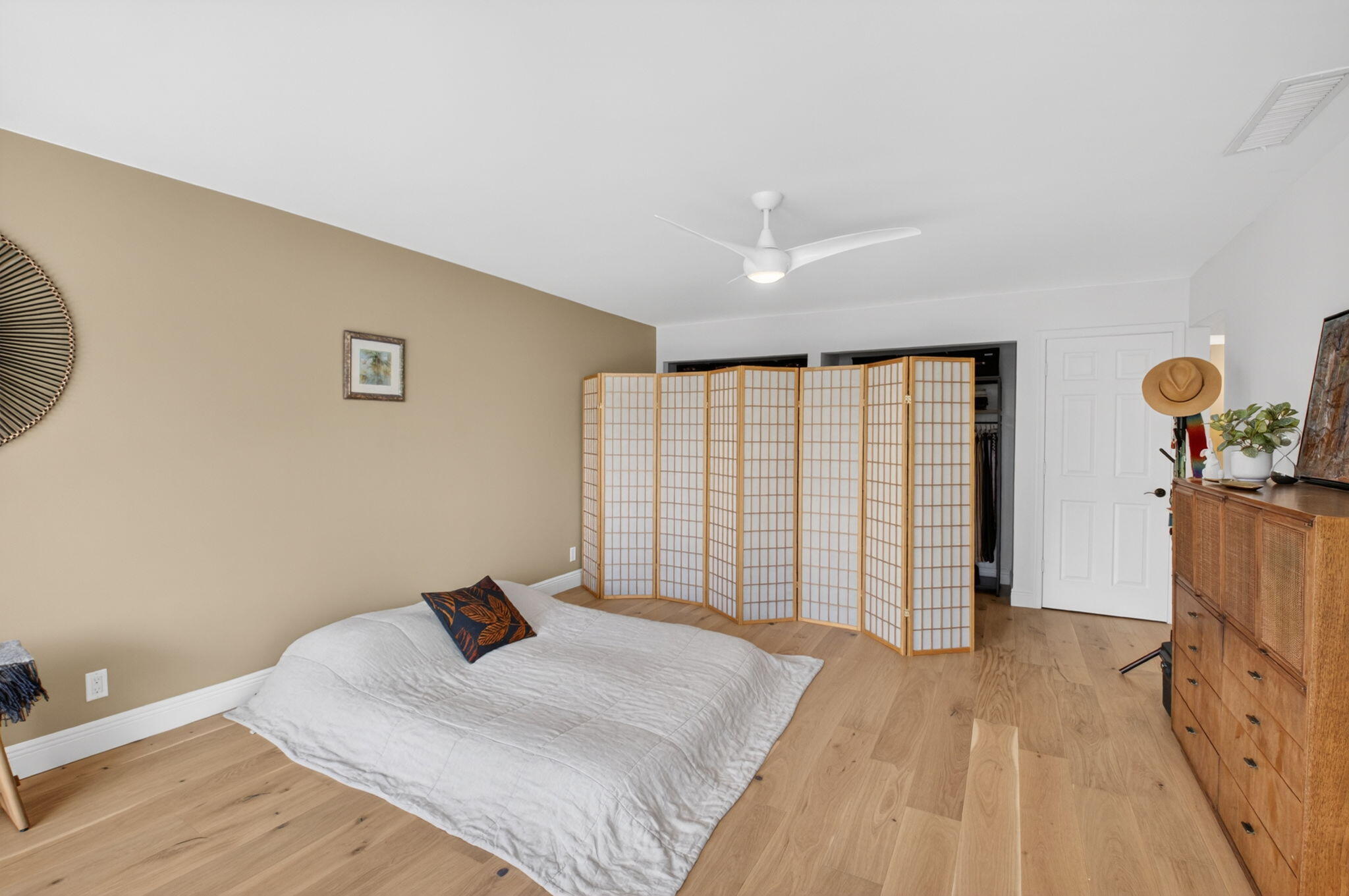 149 Northwest 70th Street, Unit 106C Boca Raton, FL 33487 - Photo 19 of 41 a bedroom with a bed and a window
