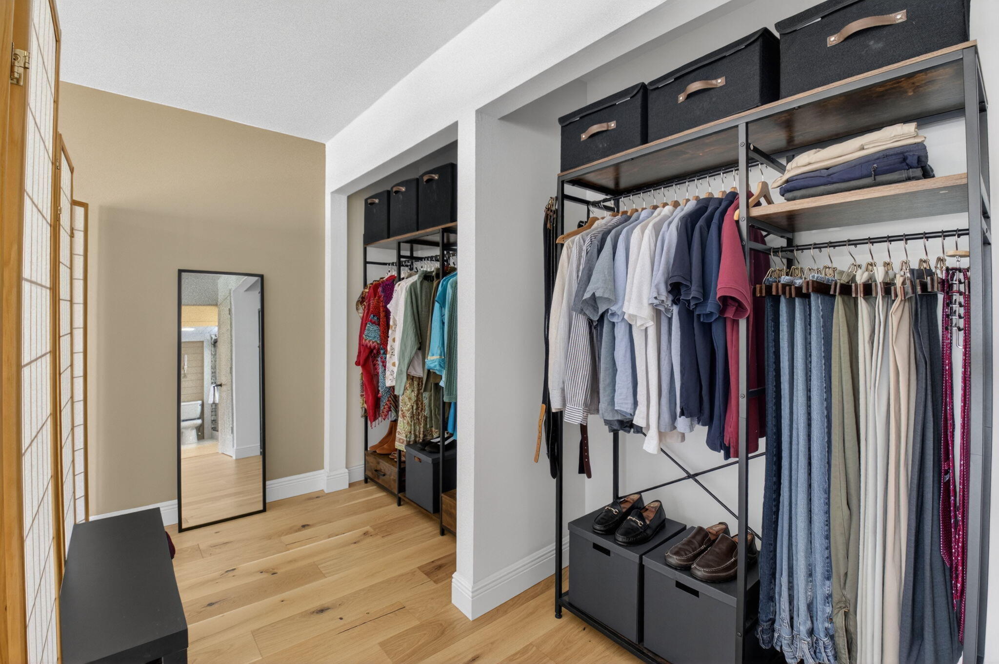 149 Northwest 70th Street, Unit 106C Boca Raton, FL 33487 - Photo 21 of 41 a view of walk in closet with clothes and shoes
