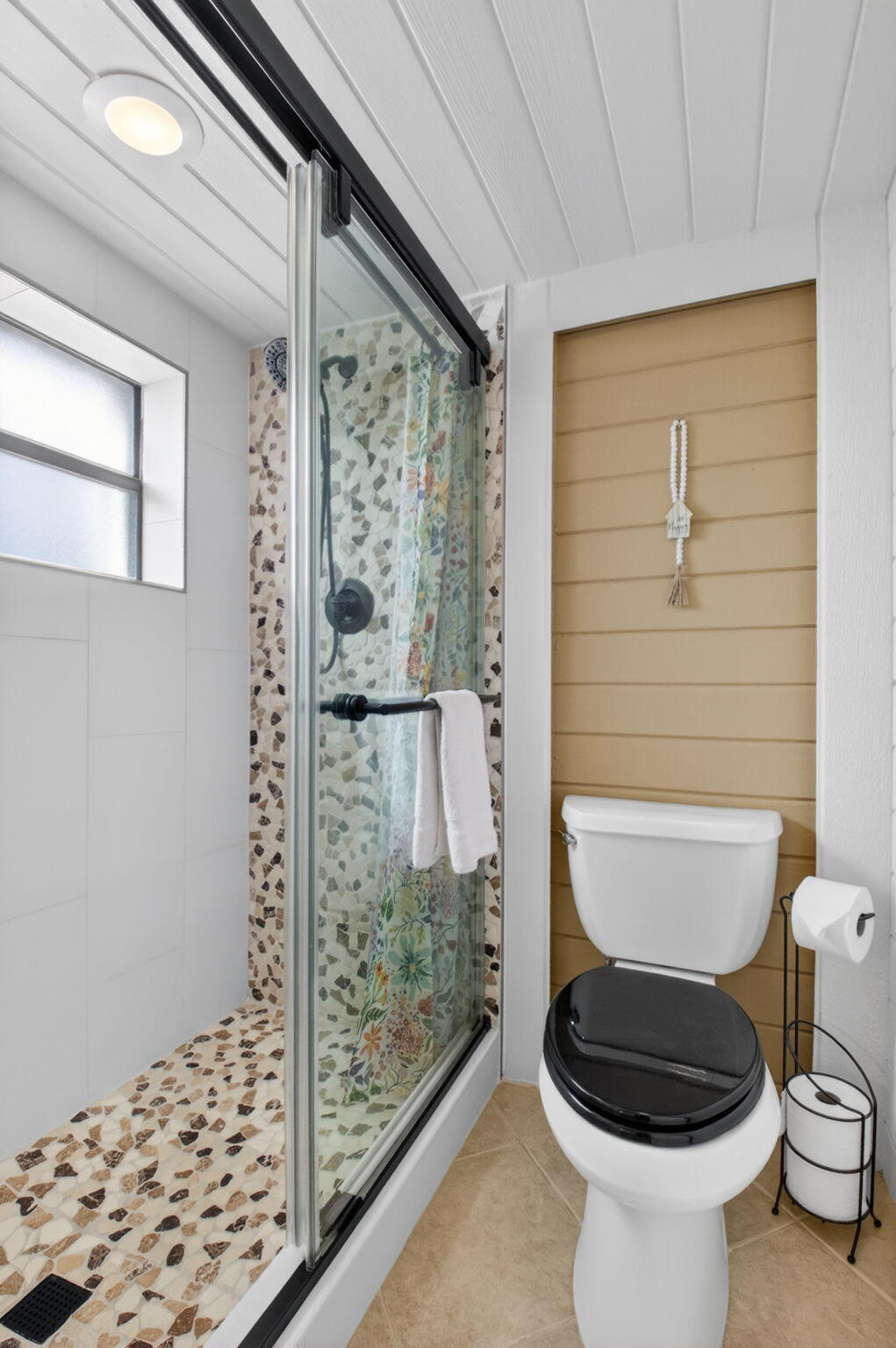 149 Northwest 70th Street, Unit 106C Boca Raton, FL 33487 - Photo 24 of 41 a bathroom with a toilet and a shower