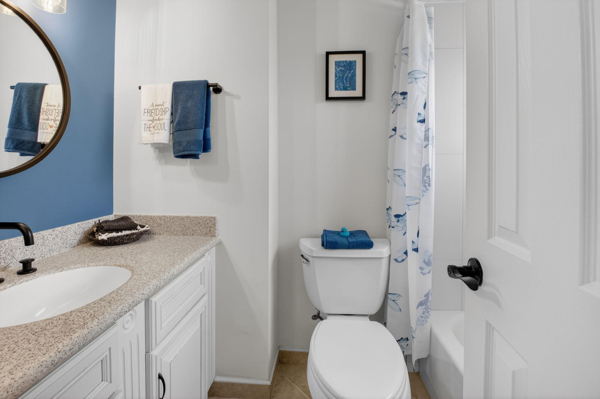 149 Northwest 70th Street, Unit 106C Boca Raton, FL 33487 - Photo 28 of 41 a bathroom with a sink toilet and mirror