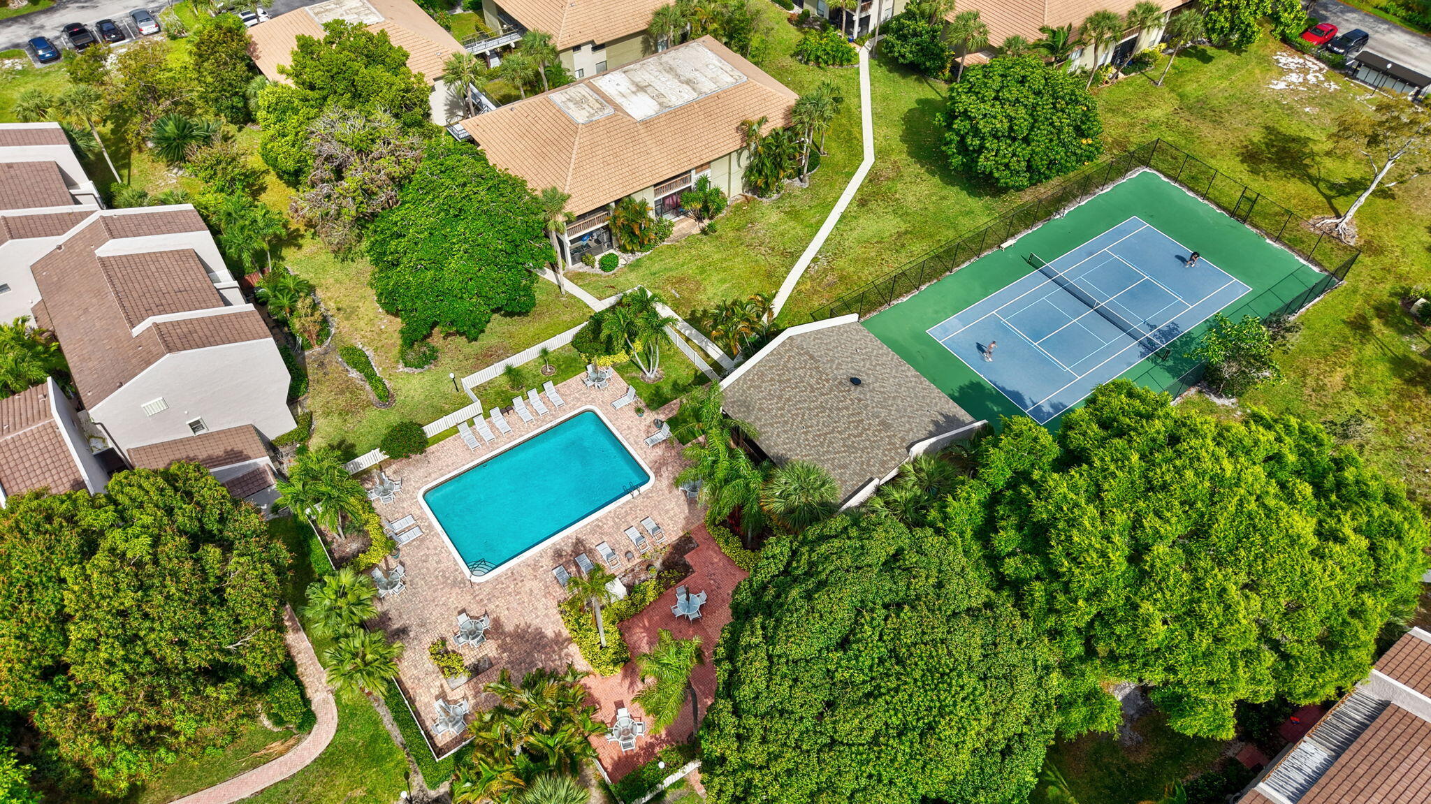 149 Northwest 70th Street, Unit 106C Boca Raton, FL 33487 - Photo 37 of 41 an aerial view of a house with a yard and trees