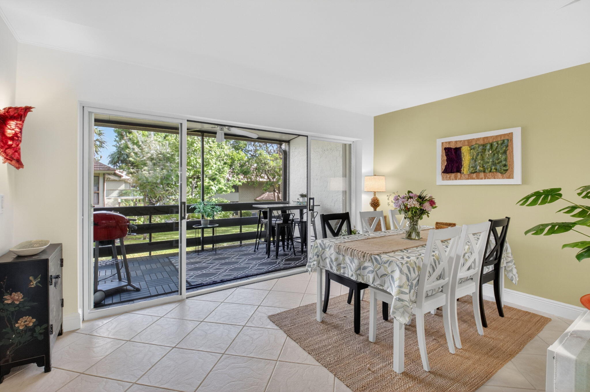 149 Northwest 70th Street, Unit 106C Boca Raton, FL 33487 - Photo 10 of 41 a view of a dining room with furniture window and outside view