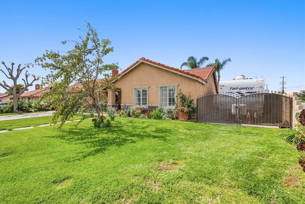 506 South Althea Avenue Rialto, CA 92376 - Photo 15 of 36 a front view of a house with garden