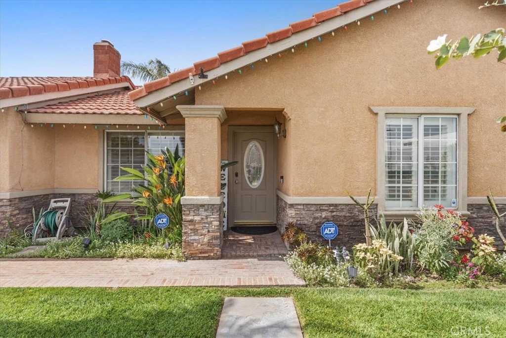 506 South Althea Avenue Rialto, CA 92376 - Photo 16 of 36 a front view of a house with garden