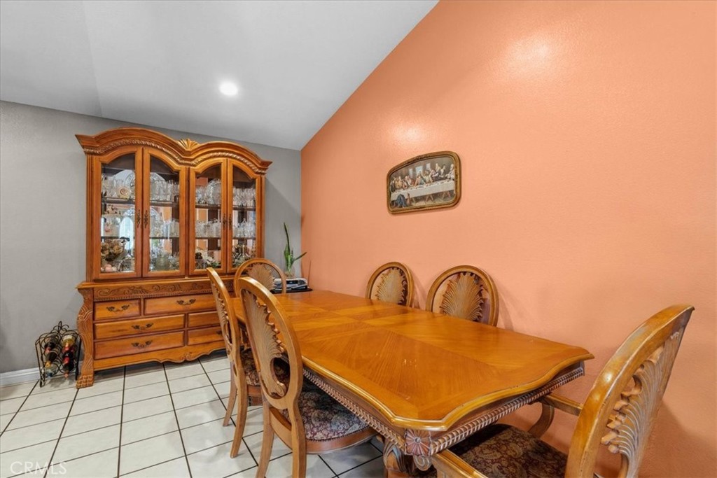 506 South Althea Avenue Rialto, CA 92376 - Photo 20 of 36 a view of a dining room with furniture and chandelier