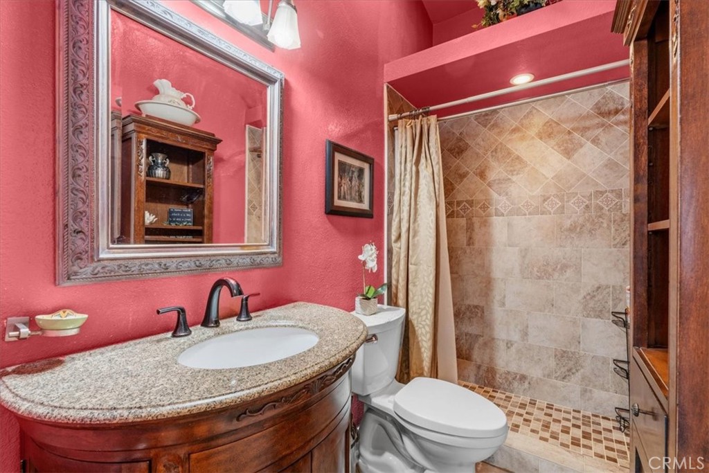 506 South Althea Avenue Rialto, CA 92376 - Photo 25 of 36 a bathroom with a sink a toilet and shower