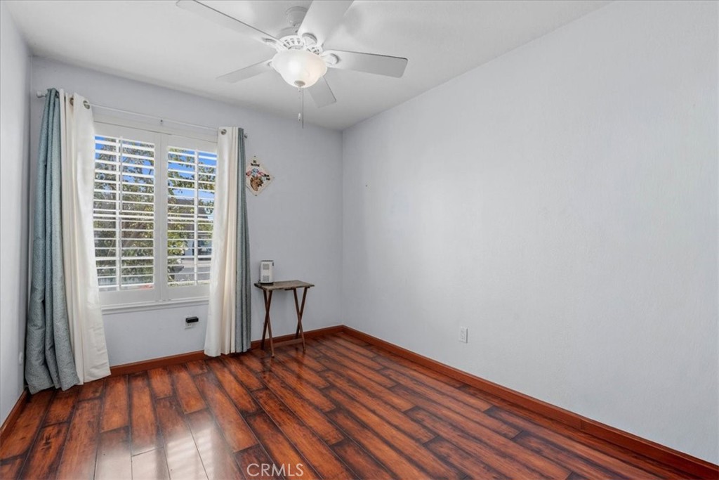 506 South Althea Avenue Rialto, CA 92376 - Photo 27 of 36 a view of an empty room with a window and wooden floor