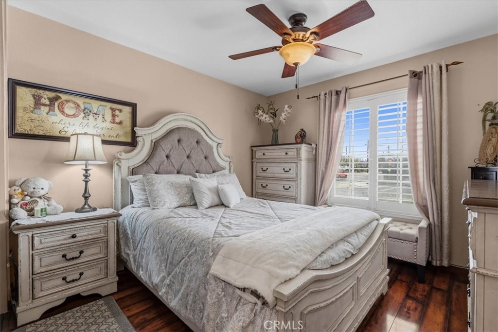 506 South Althea Avenue Rialto, CA 92376 - Photo 28 of 36 a bedroom with a bed and wooden floor