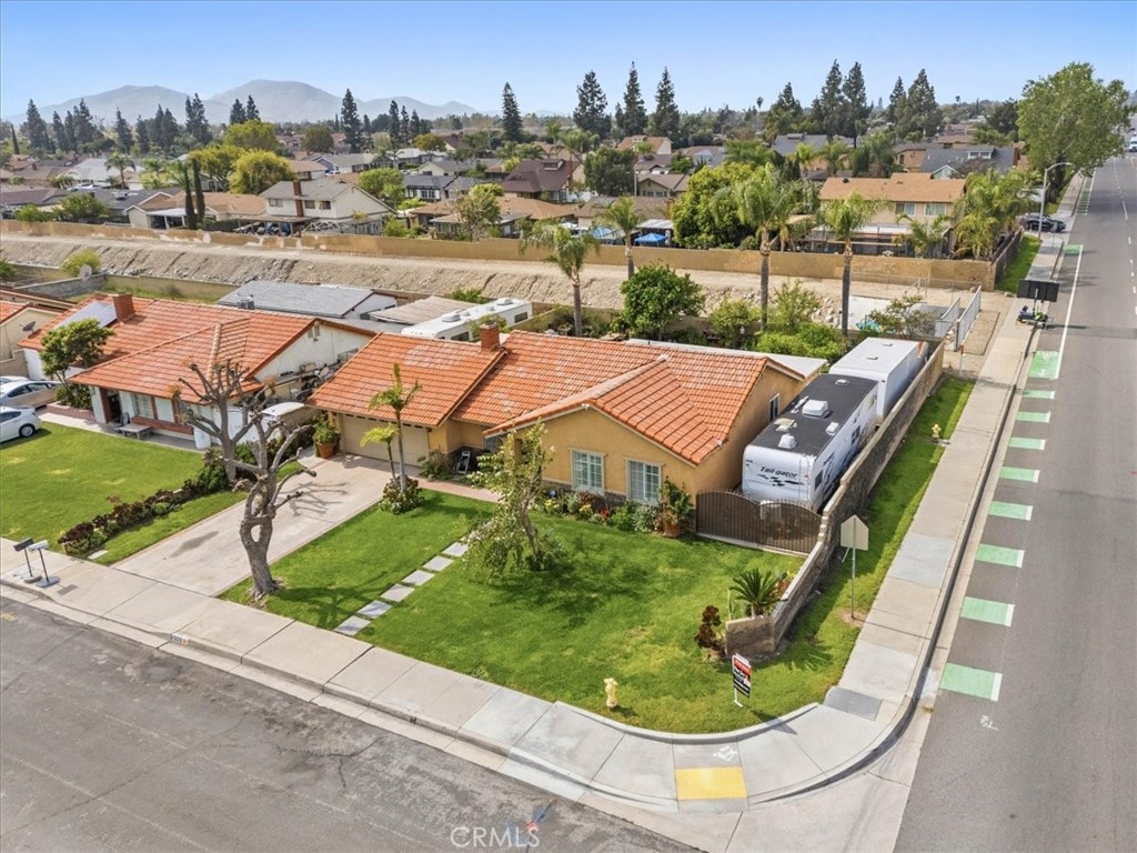 506 South Althea Avenue Rialto, CA 92376 - Photo 3 of 36 an aerial view of residential houses with outdoor space and trees