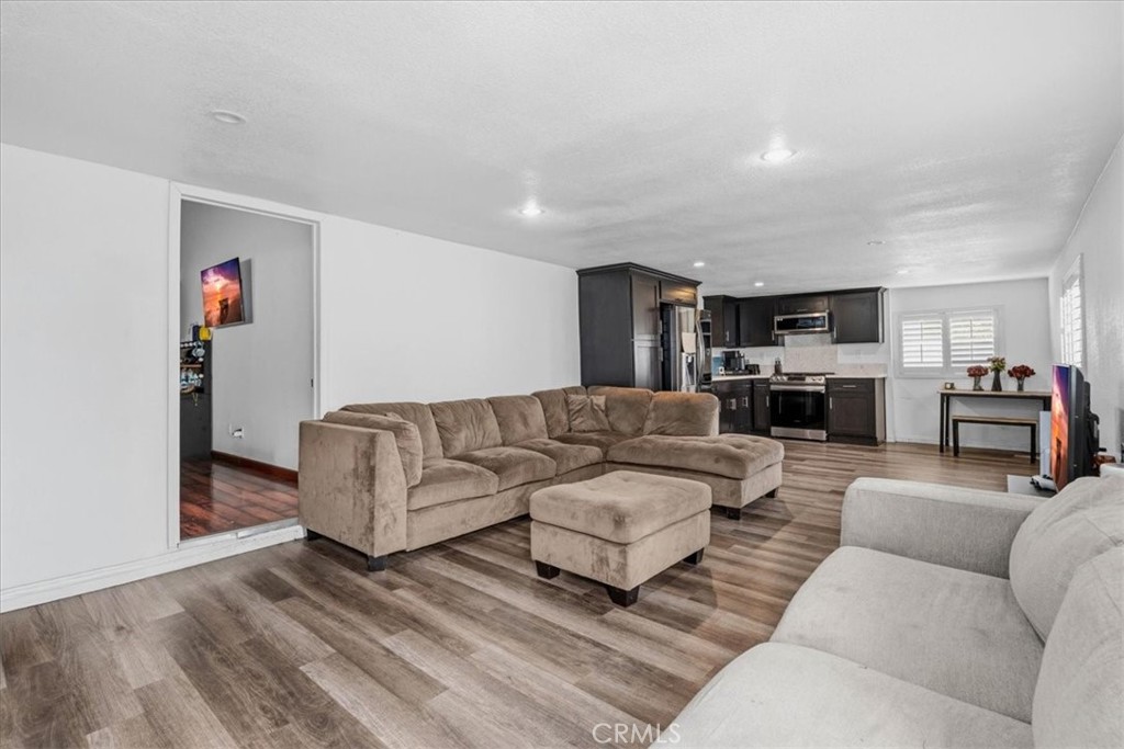 506 South Althea Avenue Rialto, CA 92376 - Photo 5 of 36 a living room with furniture and a fireplace