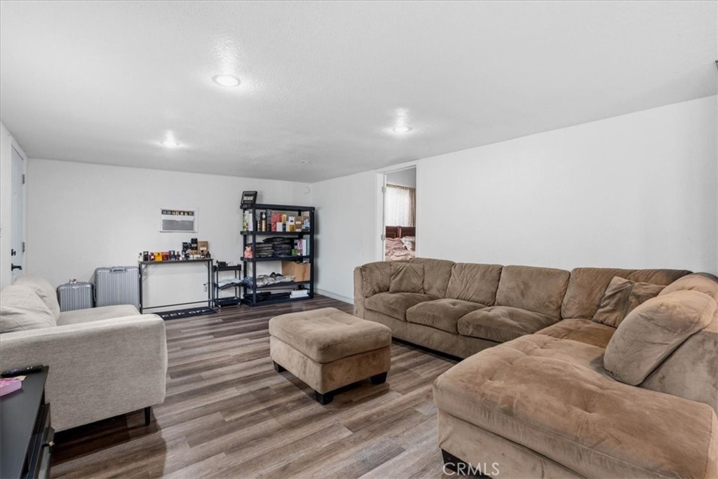 506 South Althea Avenue Rialto, CA 92376 - Photo 6 of 36 a living room with furniture and wooden floor