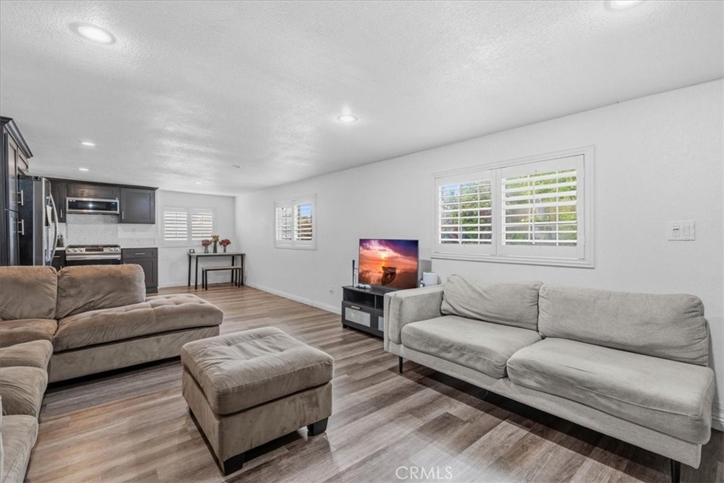 506 South Althea Avenue Rialto, CA 92376 - Photo 7 of 36 a living room with furniture and a large window