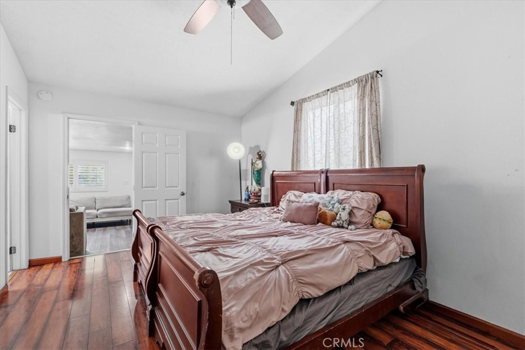 506 South Althea Avenue Rialto, CA 92376 - Photo 10 of 36 a bedroom with a bed and wooden floor