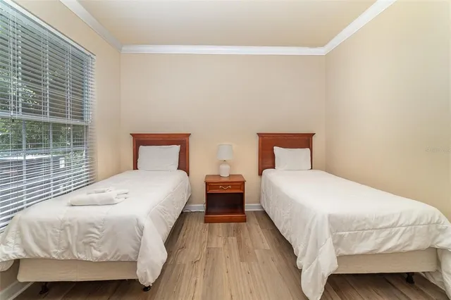 a bedroom with a bed and window