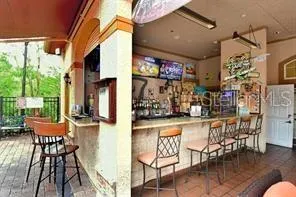 a outdoor dining space with patio furniture and wooden floor