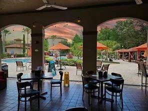 a dining room with furniture and wooden floor