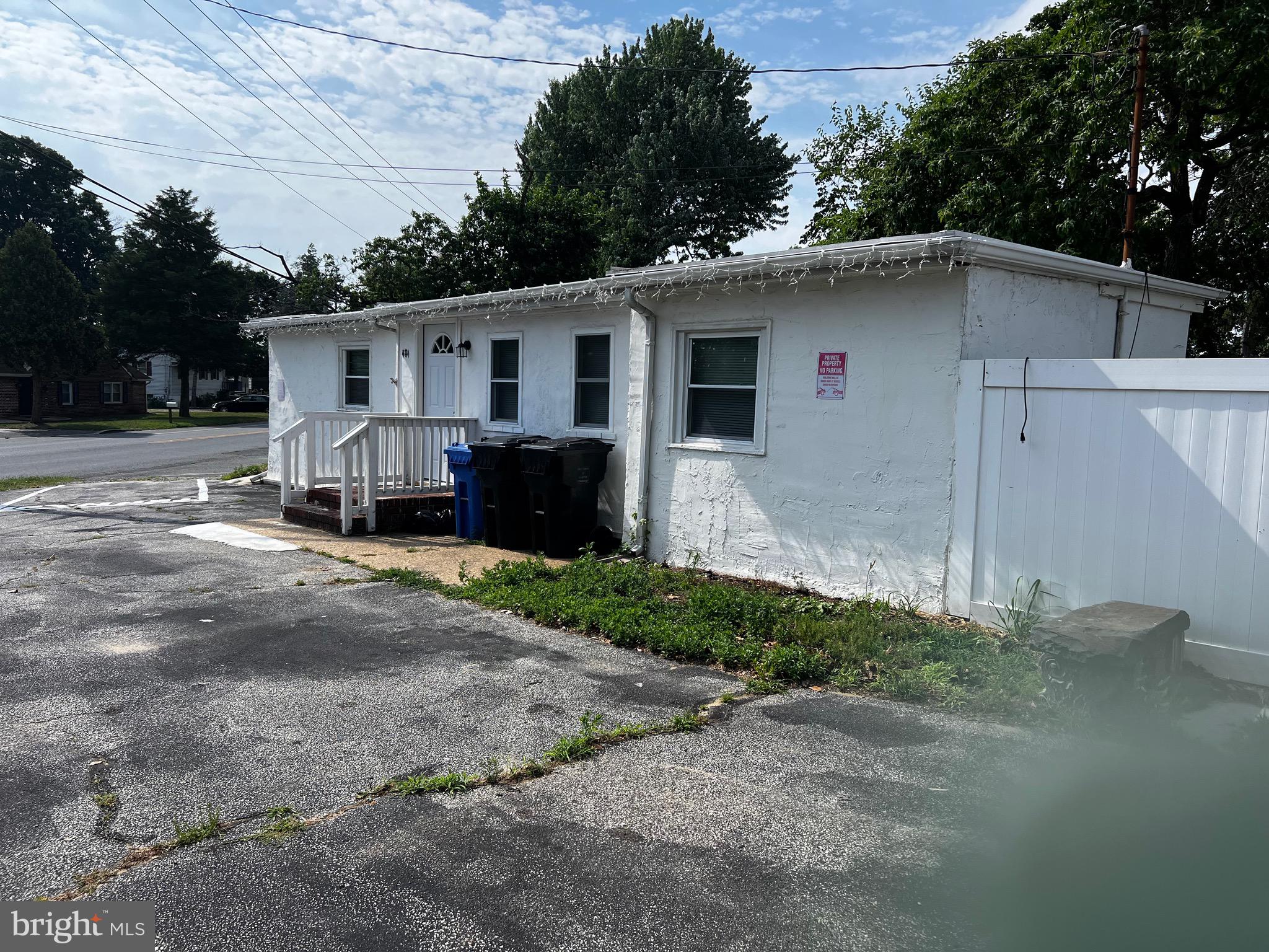 484 Harrison Avenue Mantua, NJ 08051 - Photo 2 of 14 a front view of a house with a yard
