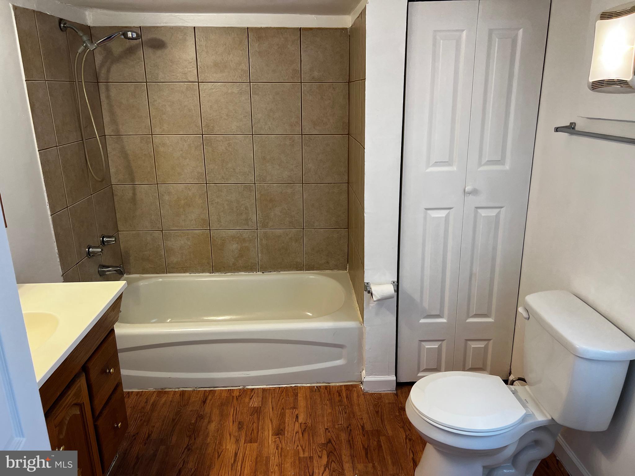 484 Harrison Avenue Mantua, NJ 08051 - Photo 9 of 14 a bathroom with a sink a toilet and shower