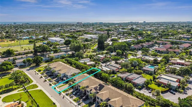 an aerial view of residential houses with outdoor space