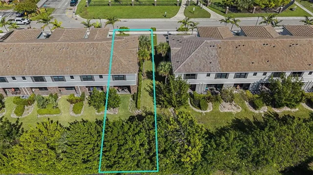an aerial view of a house with yard swimming pool and outdoor seating