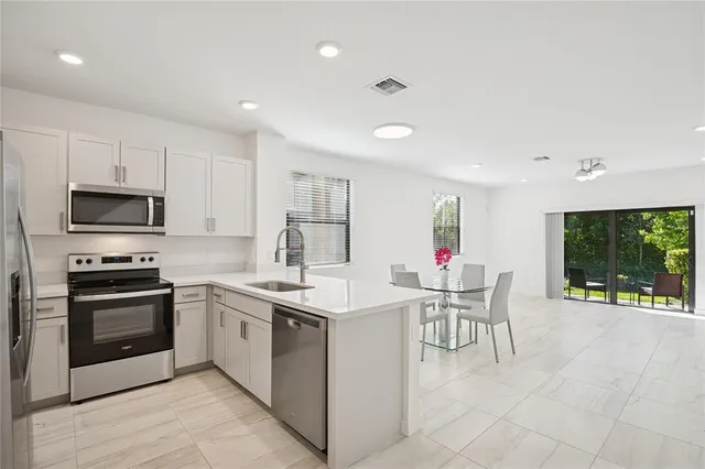a kitchen that has a cabinets counter space and appliances