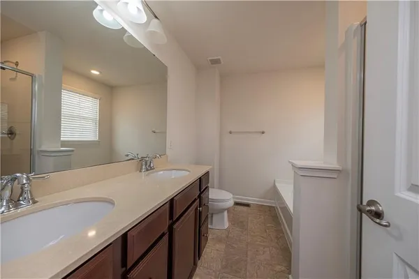 a bathroom with a sink a vanity and a mirror