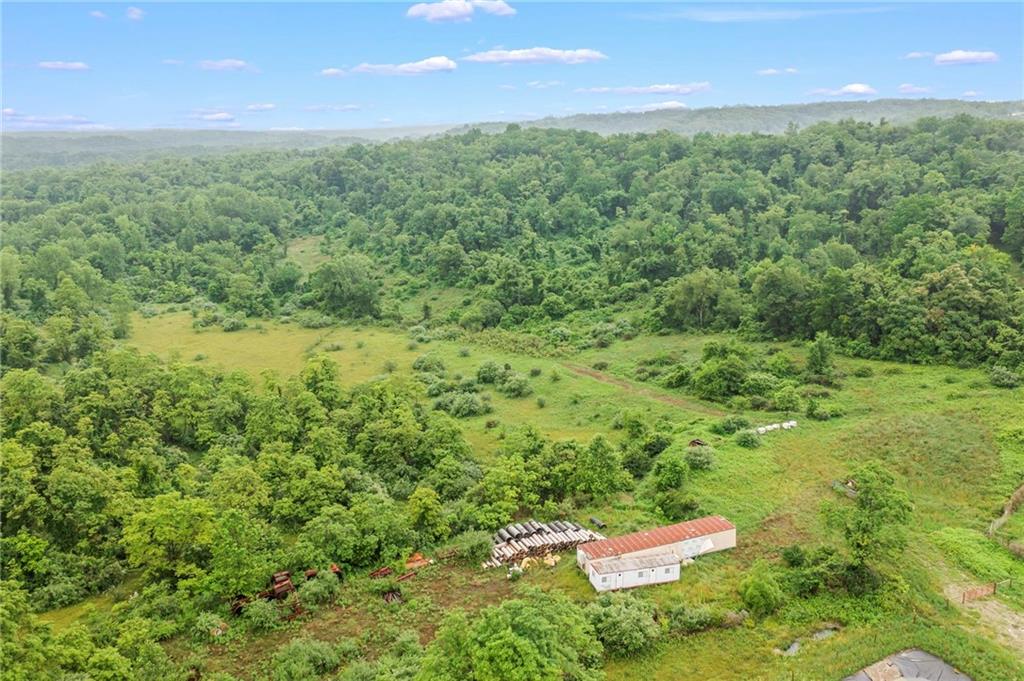327 Eldersville Road Burgettstown, PA 15021 - Photo 7 of 10 a backyard of a house with a yard and outdoor seating