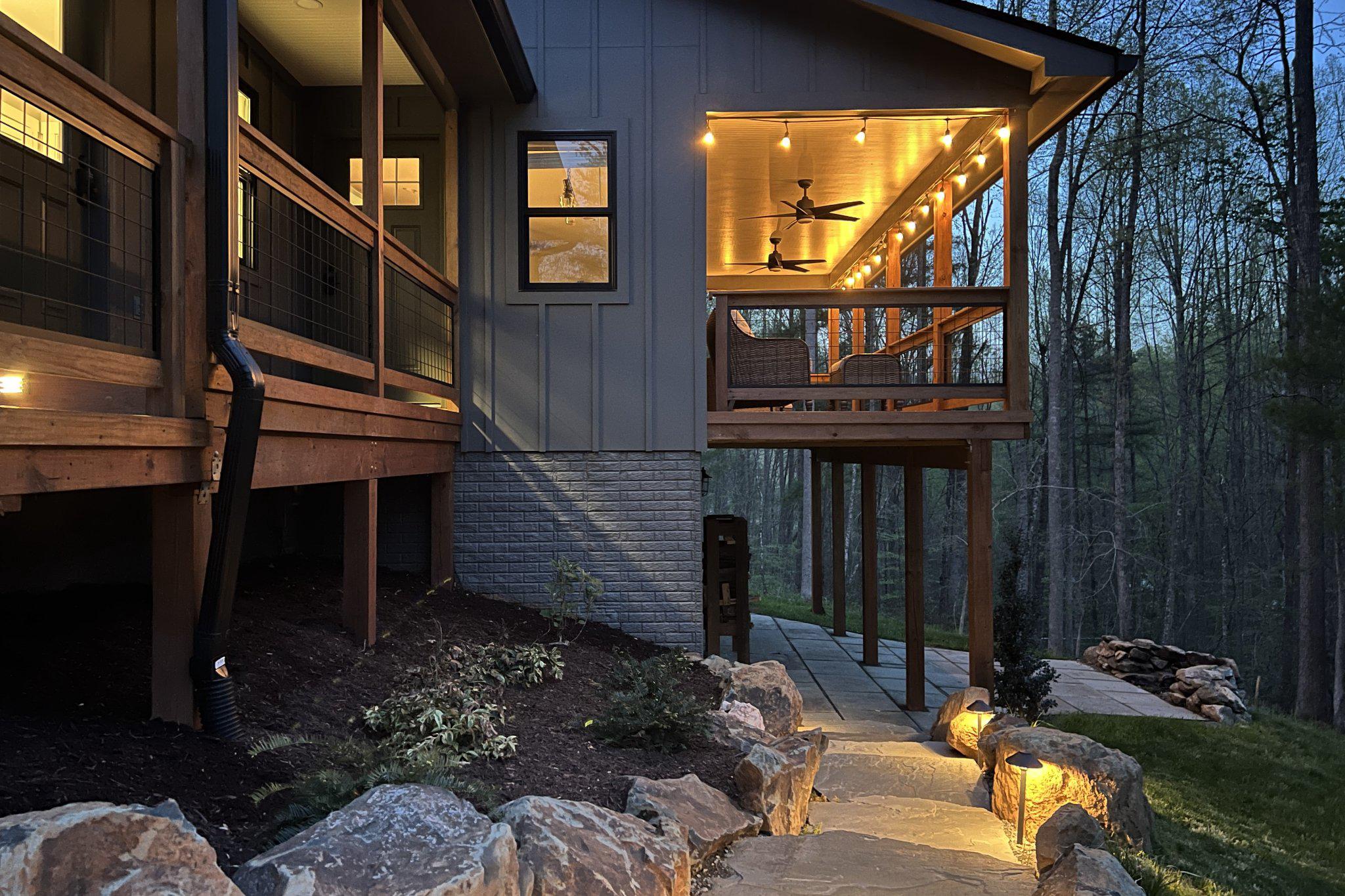 677 Weaver Hollow Road Banco, VA 22711 - Photo 32 of 34 Path lighting sets off the stonework at night