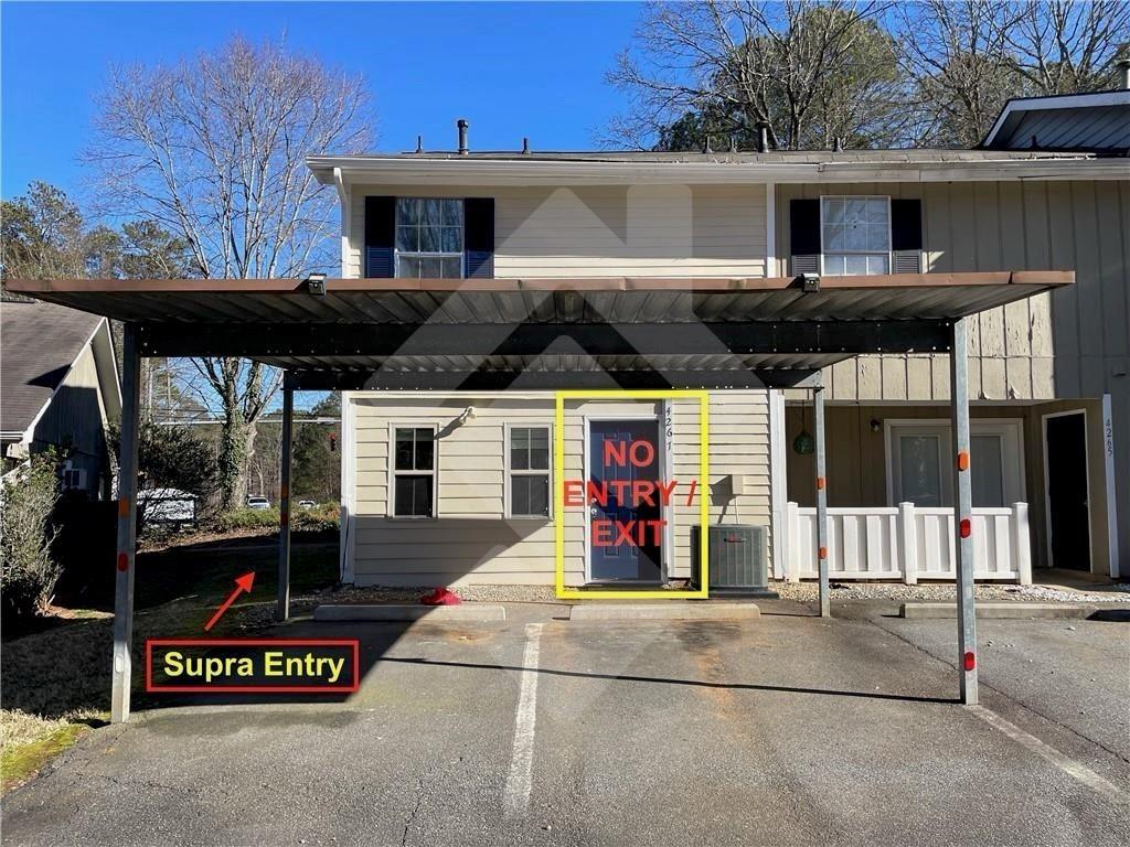 4267 Grogan Street Acworth, GA 30101 - Photo 35 of 37 a front view of a house with a garage