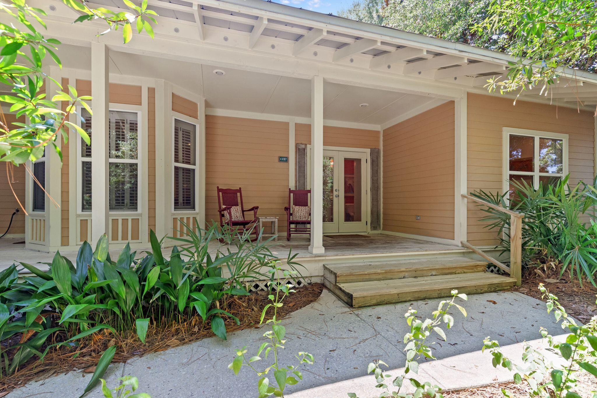a front view of a house with garden