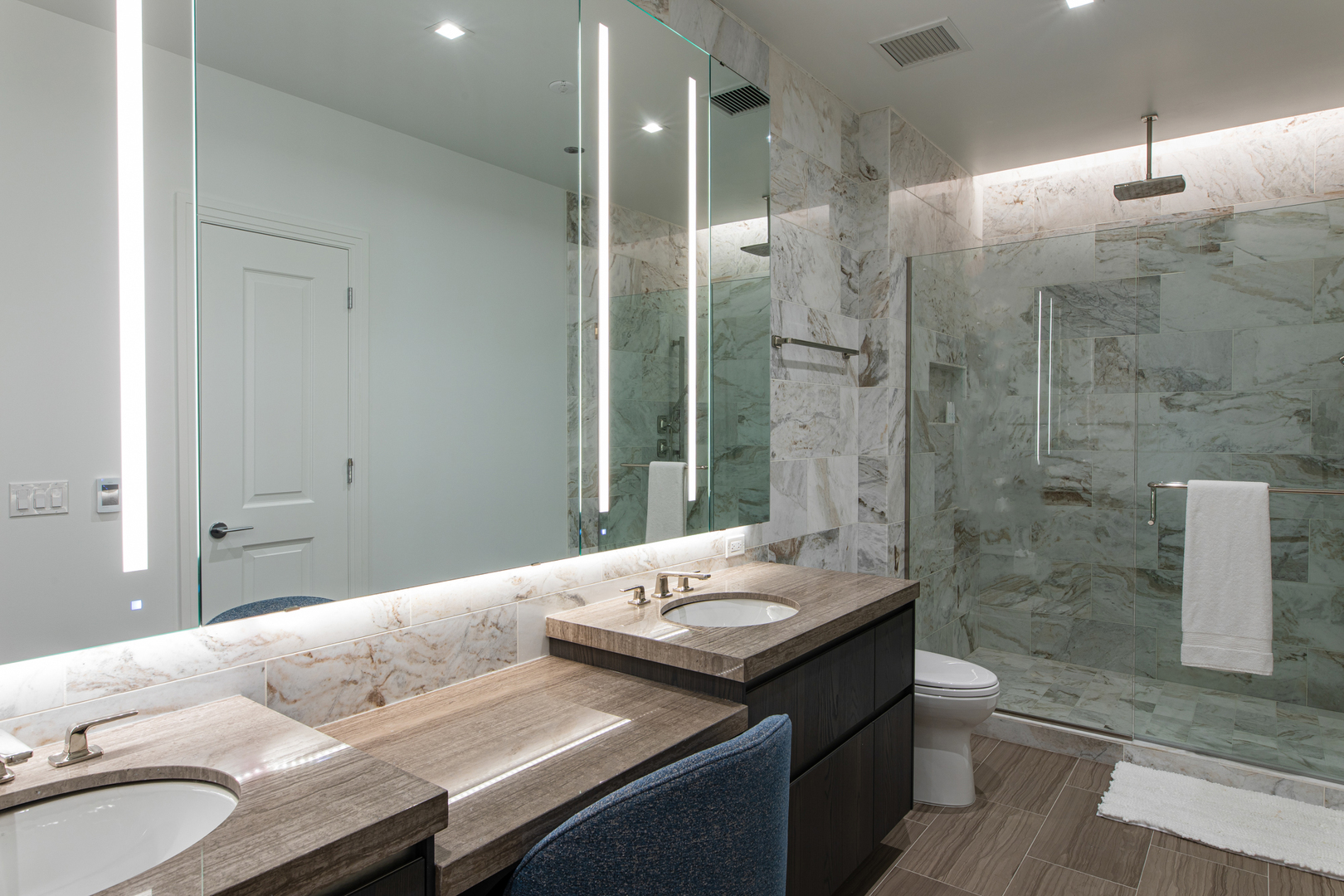 363 East Wacker Drive, Unit 5505 Chicago, IL 60601 - Photo 9 of 26 a bathroom with a granite countertop sink a toilet and shower
