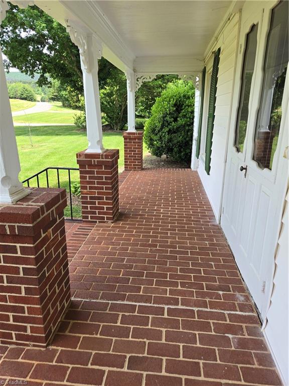 1560 Gentry Farm Road King, NC 27021 - Photo 7 of 49 Brick front porch