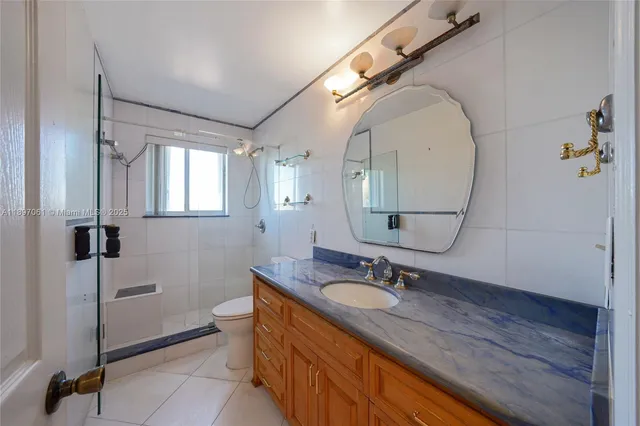 a bathroom with a sink double vanity and a mirror